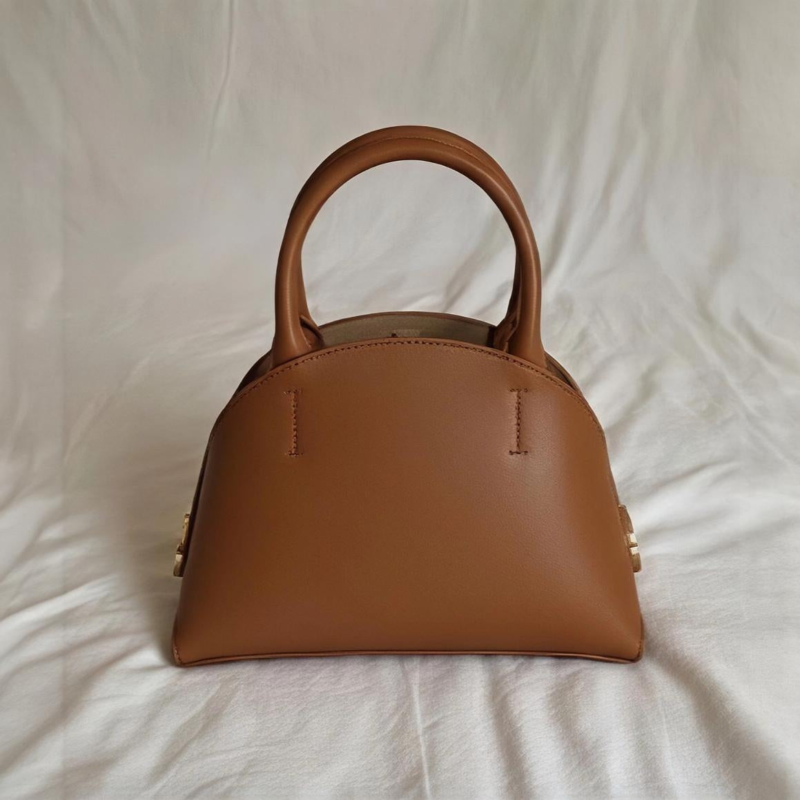 Handle Dome Bag in tan.