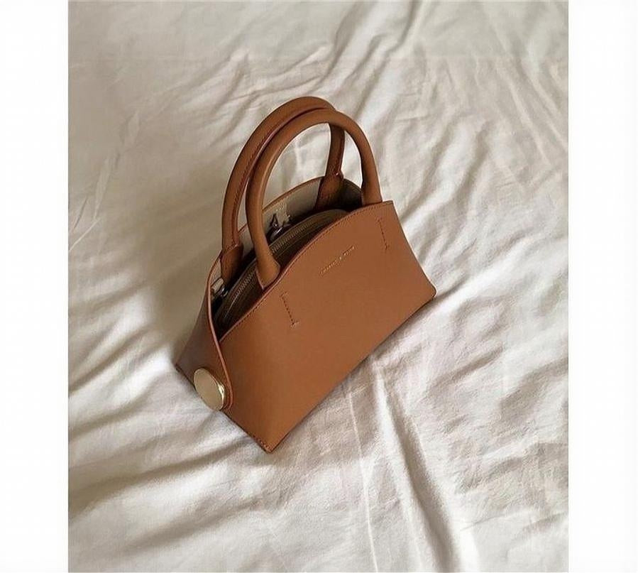 Handle Dome Bag in tan.
